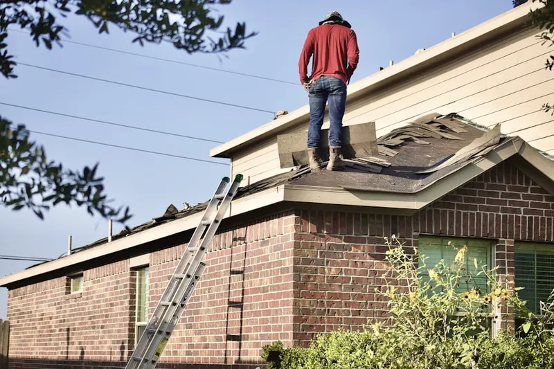 Professional roofer working on a residential roof in Downtown New Braunfels